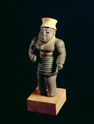 イラン南西部の雲母、スーサからの口ひげを生やしたひげを生やした男の像、金と石